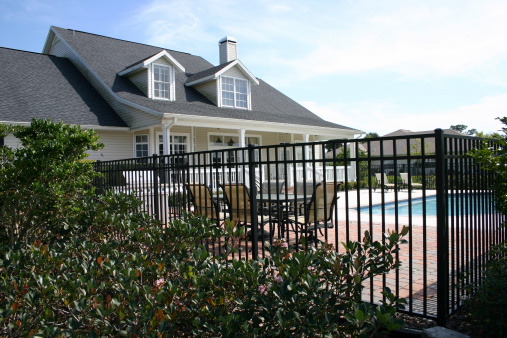 Colonial style home with a pool fence and gate auckland